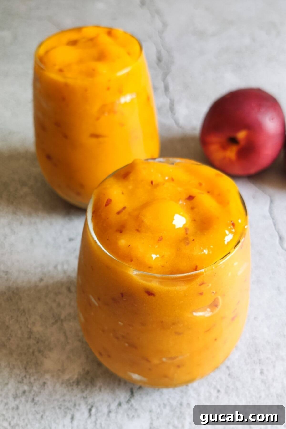 Sweet Chill: 15 Irresistible Frozen Peach Recipes 11 a peach mango smoothie.