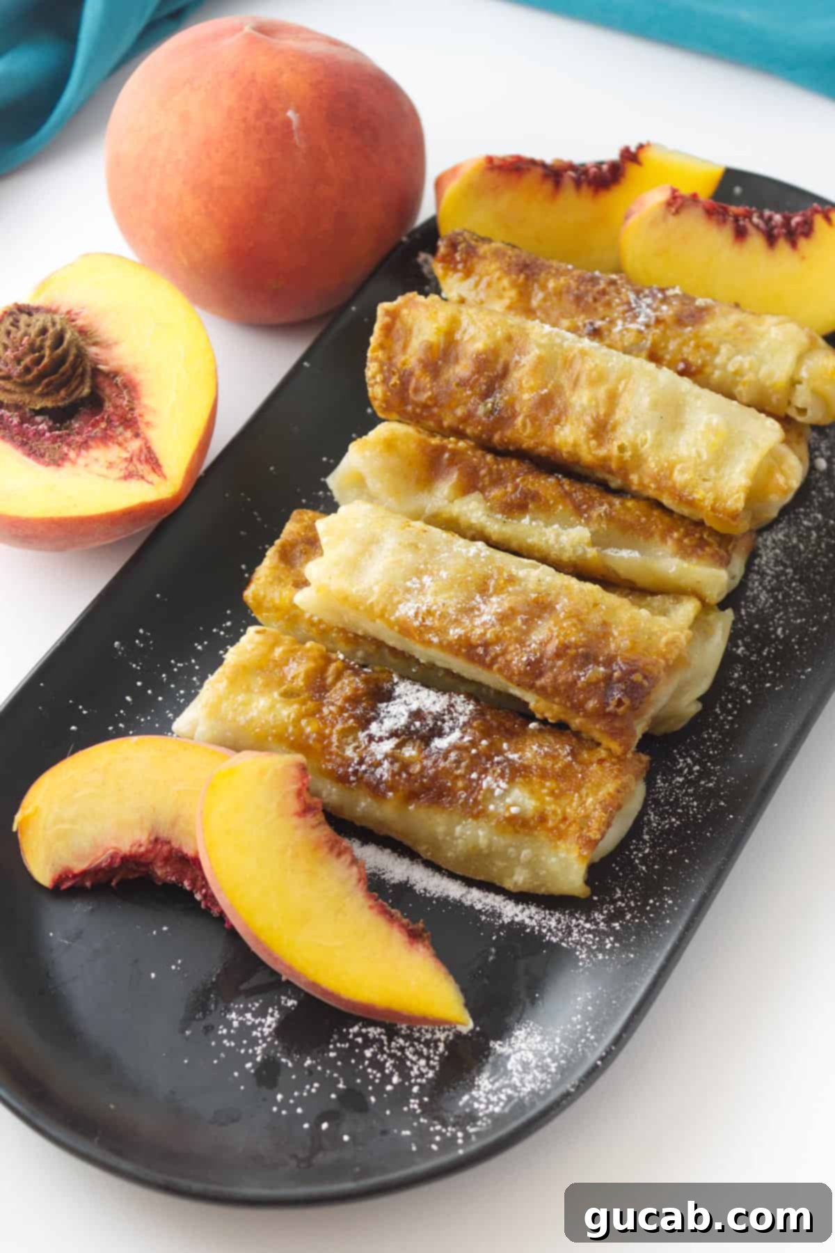 Sweet Chill: 15 Irresistible Frozen Peach Recipes 8 a plate of peach egg rolls.