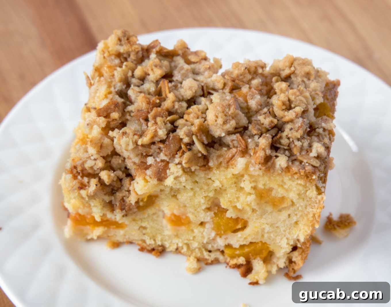 Sweet Chill: 15 Irresistible Frozen Peach Recipes 9 a slice of peach buckle.