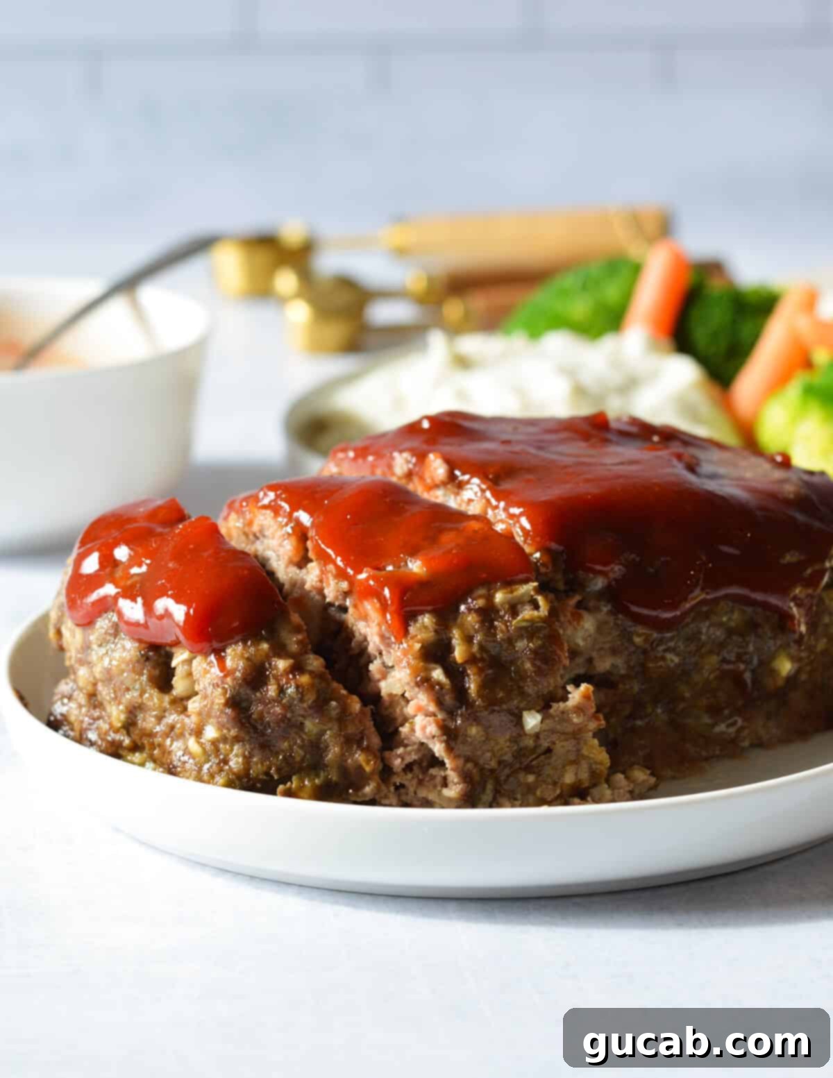 sliced meatloaf on a plate. 