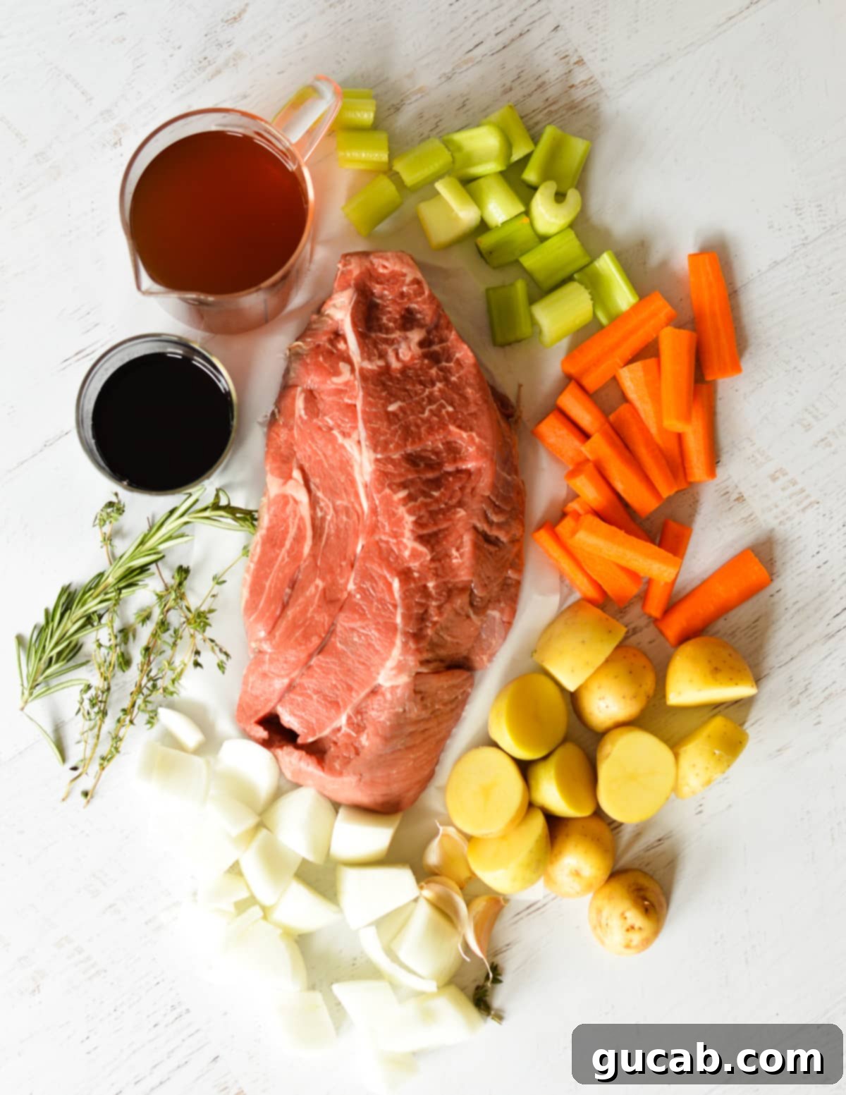 chuck roast, carrots, onions, celery, potatoes, beef broth, red wine, garlic, herbs. 