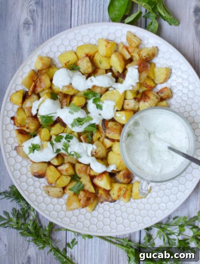 crispy oven roasted potatoes with herb sour cream