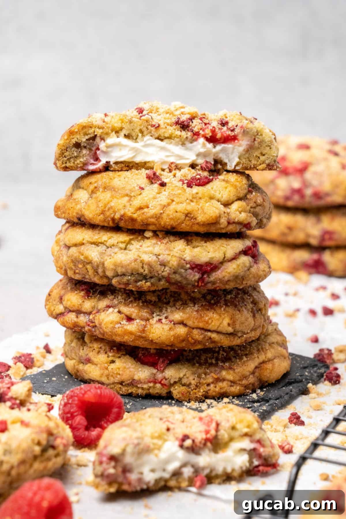 Next-Level Cookies: 25 Recipes You Need to Bake 13 A stack of luscious raspberry cheesecake cookies, showing off their filling.