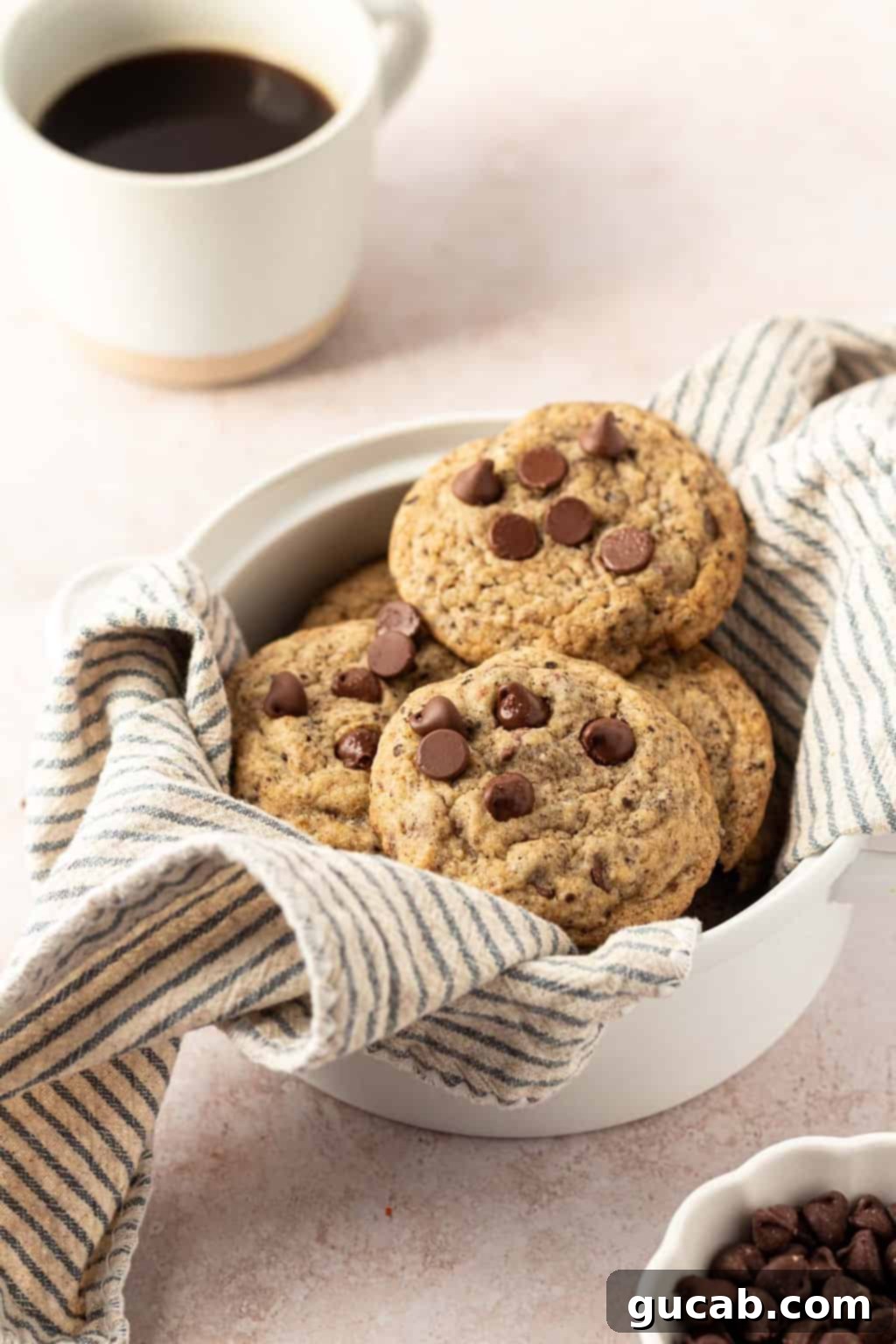 Next-Level Cookies: 25 Recipes You Need to Bake 6 Inviting chocolate chip espresso cookies in a rustic bowl.