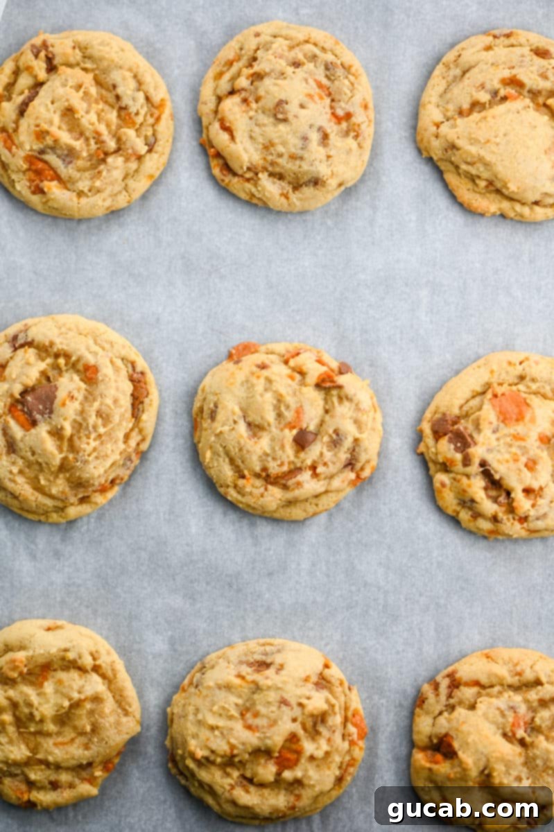 Next-Level Cookies: 25 Recipes You Need to Bake 8 Delicious Butterfinger cookies on a baking sheet.