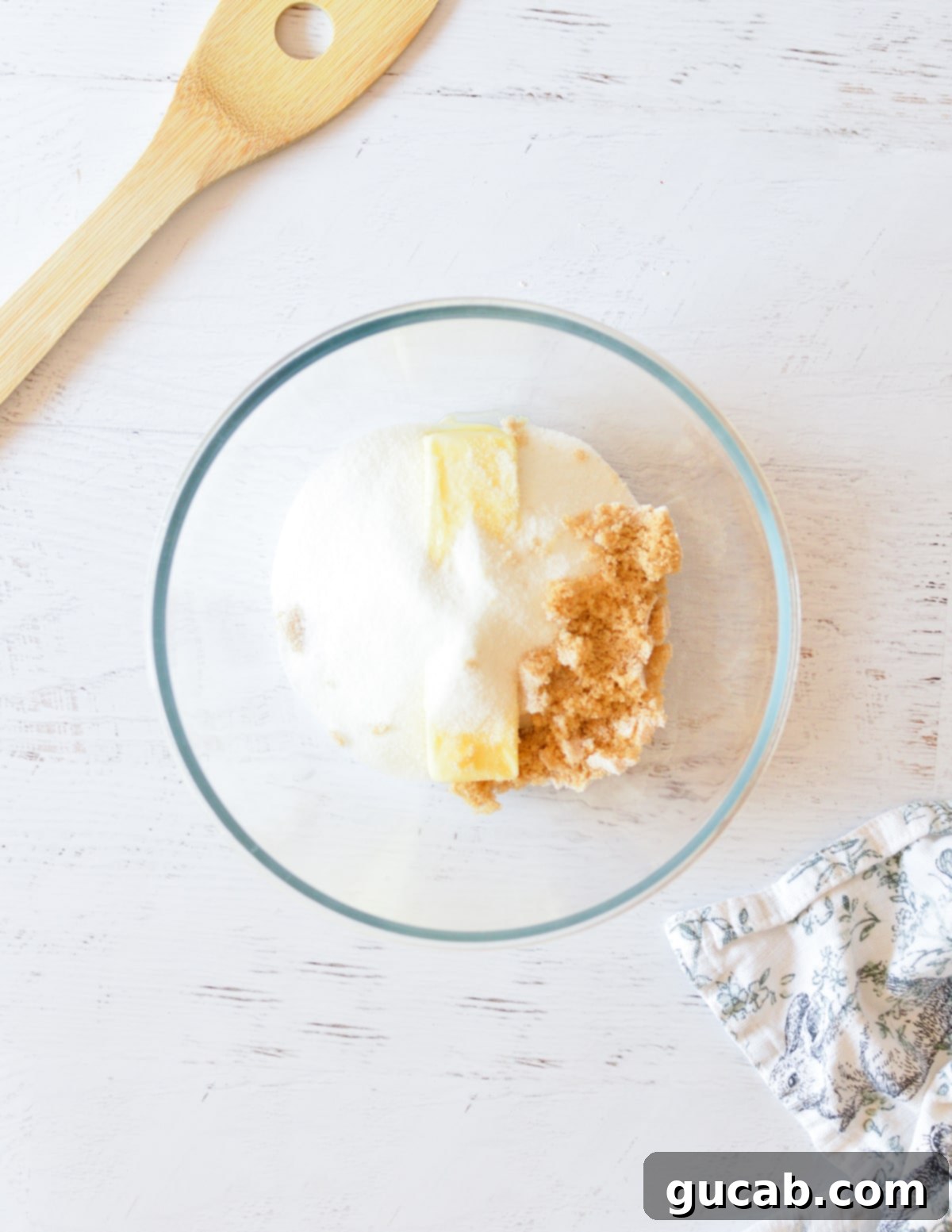 butter, sugar, and brown sugar in a bowl. 