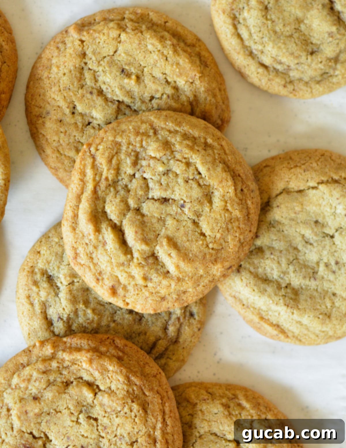 Multiple coffee cookies neatly layered on top of each other, highlighting their uniform size and appealing texture.