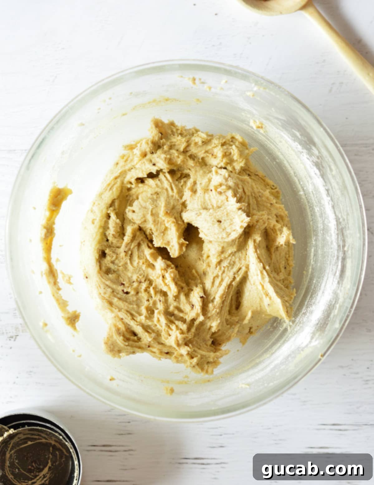 Finished coffee cookie dough in a mixing bowl, smooth and ready for shaping.