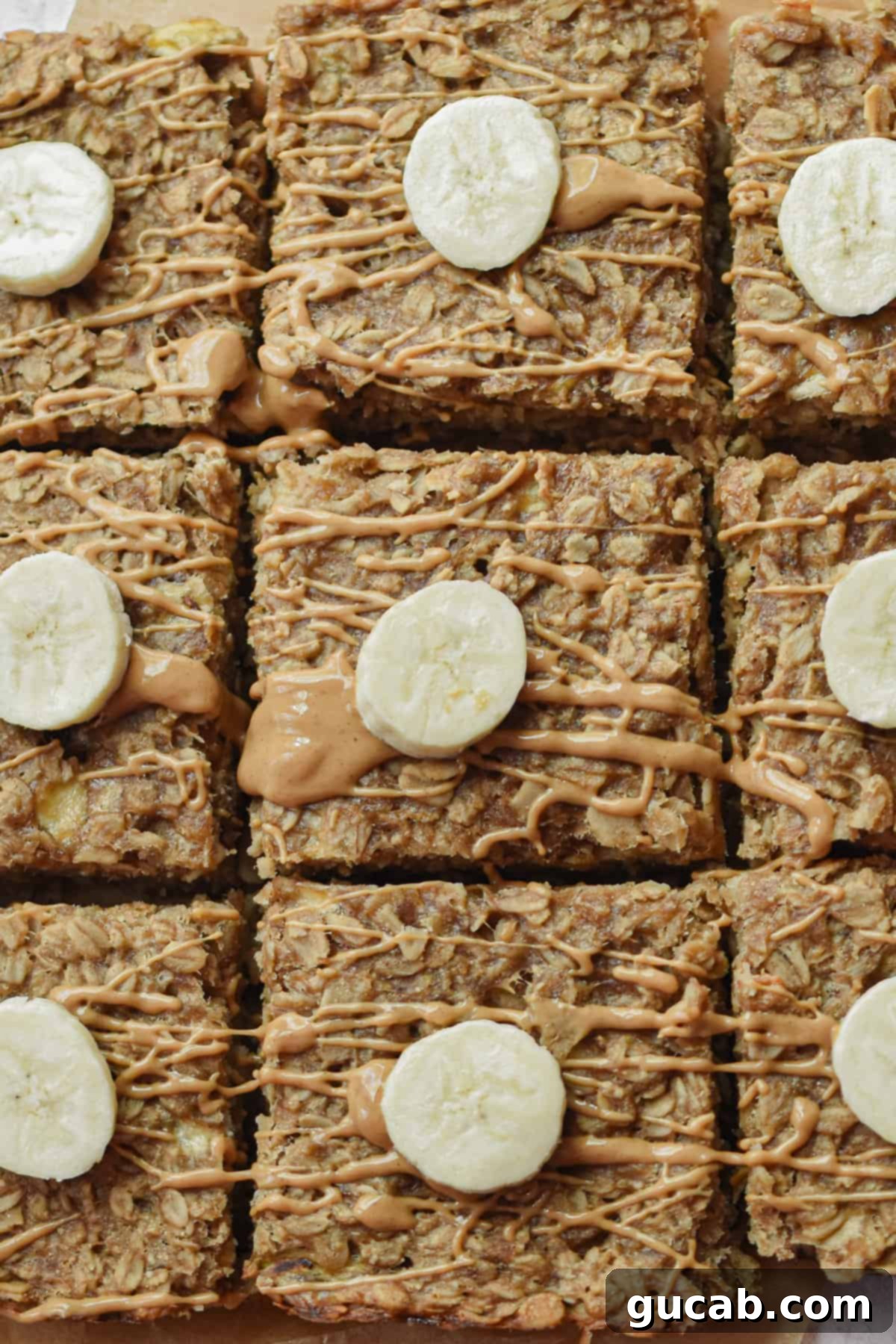 17 Delicious Frozen Banana Treats 20 banana oatmeal bars with a slice of banana on top.