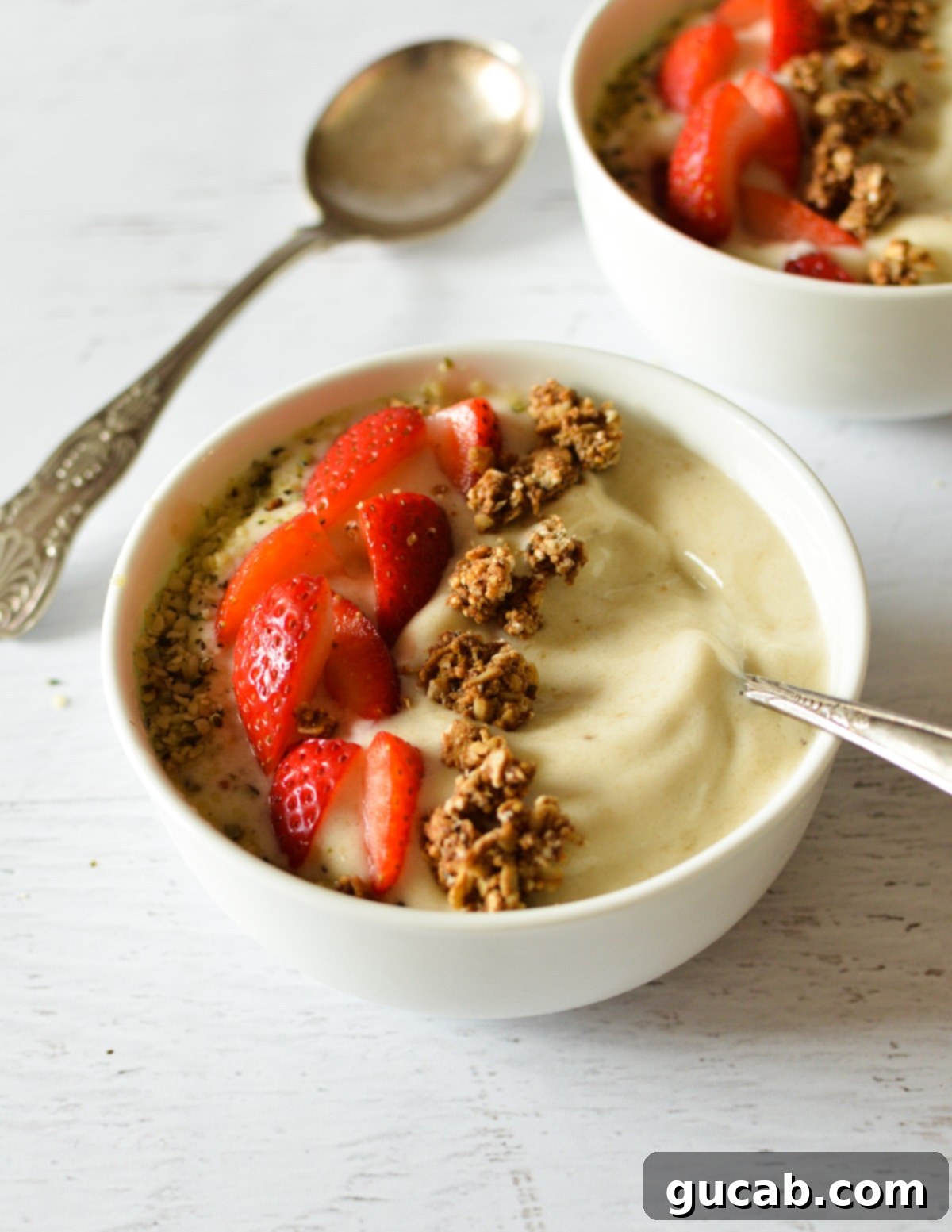 banana smoothie bowl with fruit and granola.