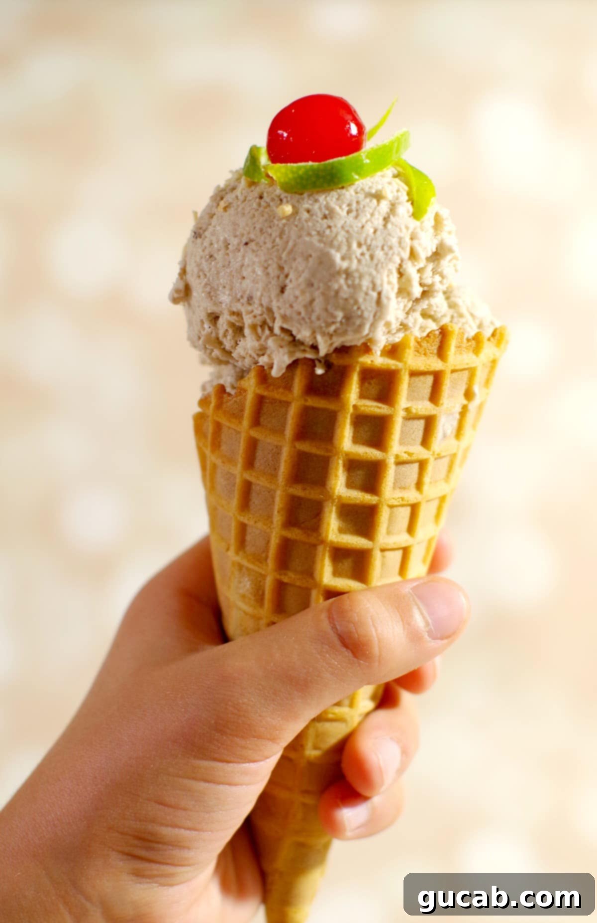 hand holding a cone of banana nice cream. 