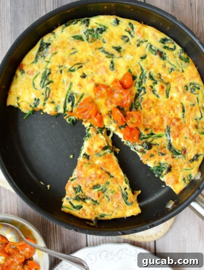 Delicious spinach frittata topped with sweet cherry tomato jam, perfect for any meal