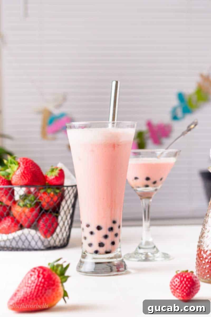 23 Irresistible Frozen Strawberry Delights 16 a strawberry milk tea with boba pearls.