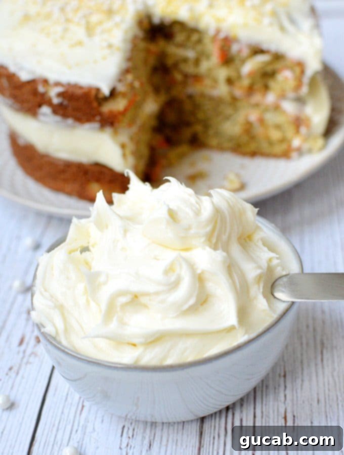 A beautifully frosted cupcake with cream cheese frosting, ready to be enjoyed.