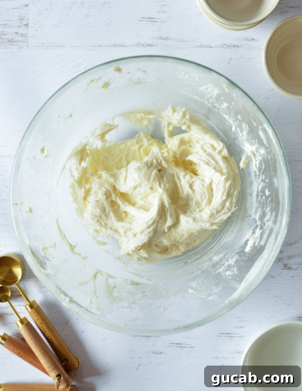 The finished, perfectly smooth and creamy cream cheese frosting in a mixing bowl.
