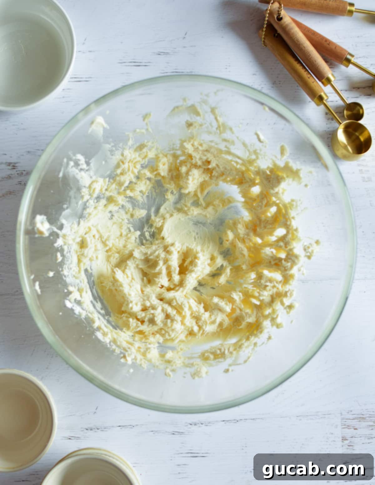 A close-up of the smooth, combined mixture of cream cheese, butter, and vanilla.