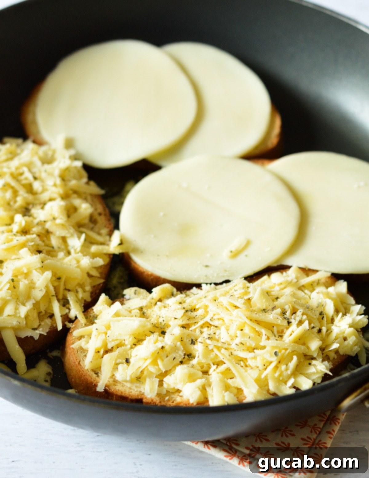 Gourmet Provolone Grilled Cheese 7 bread with cheese on it in a skillet.