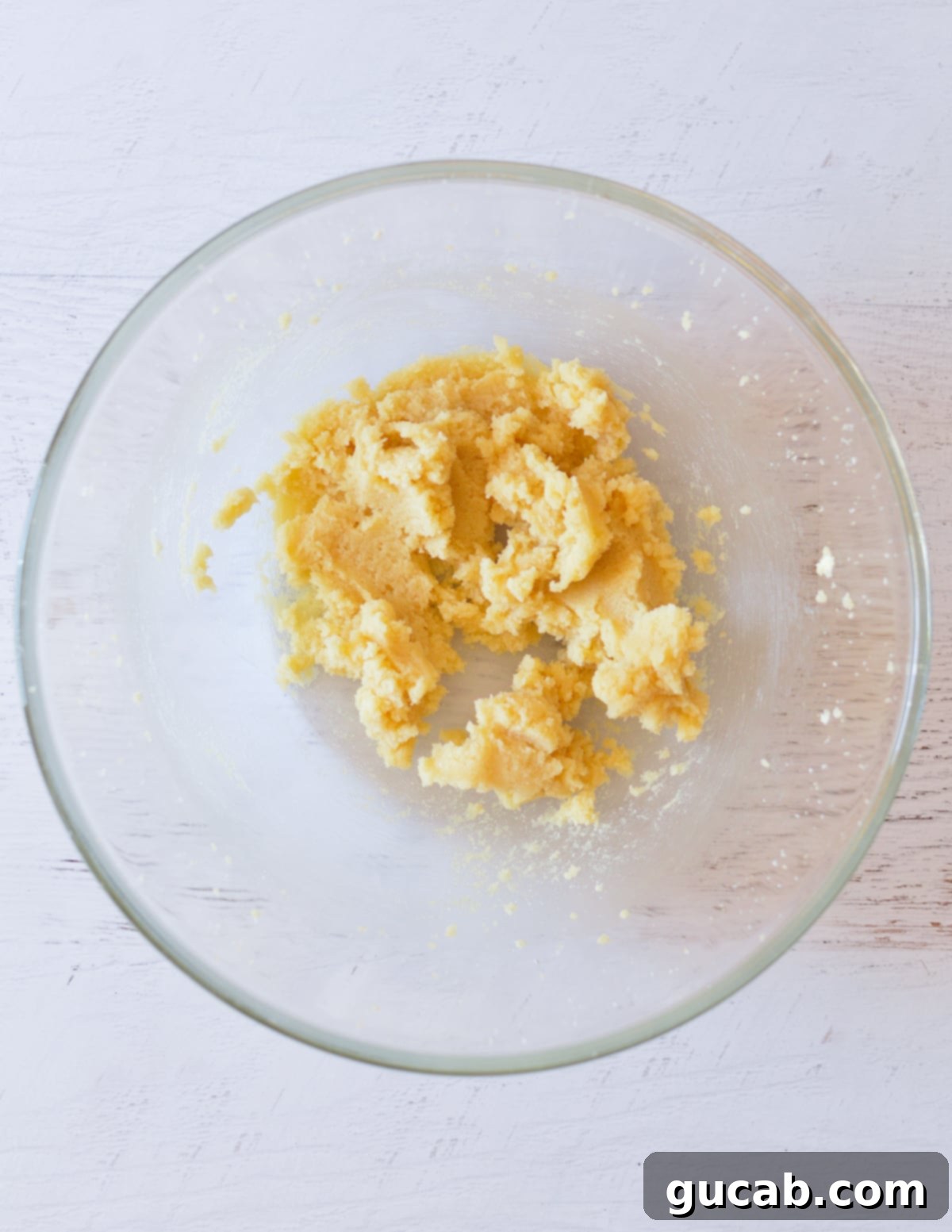 Wholesome Fiber Cookies 5 Creamed butter and sugar in a bowl, showing a smooth and aerated consistency.