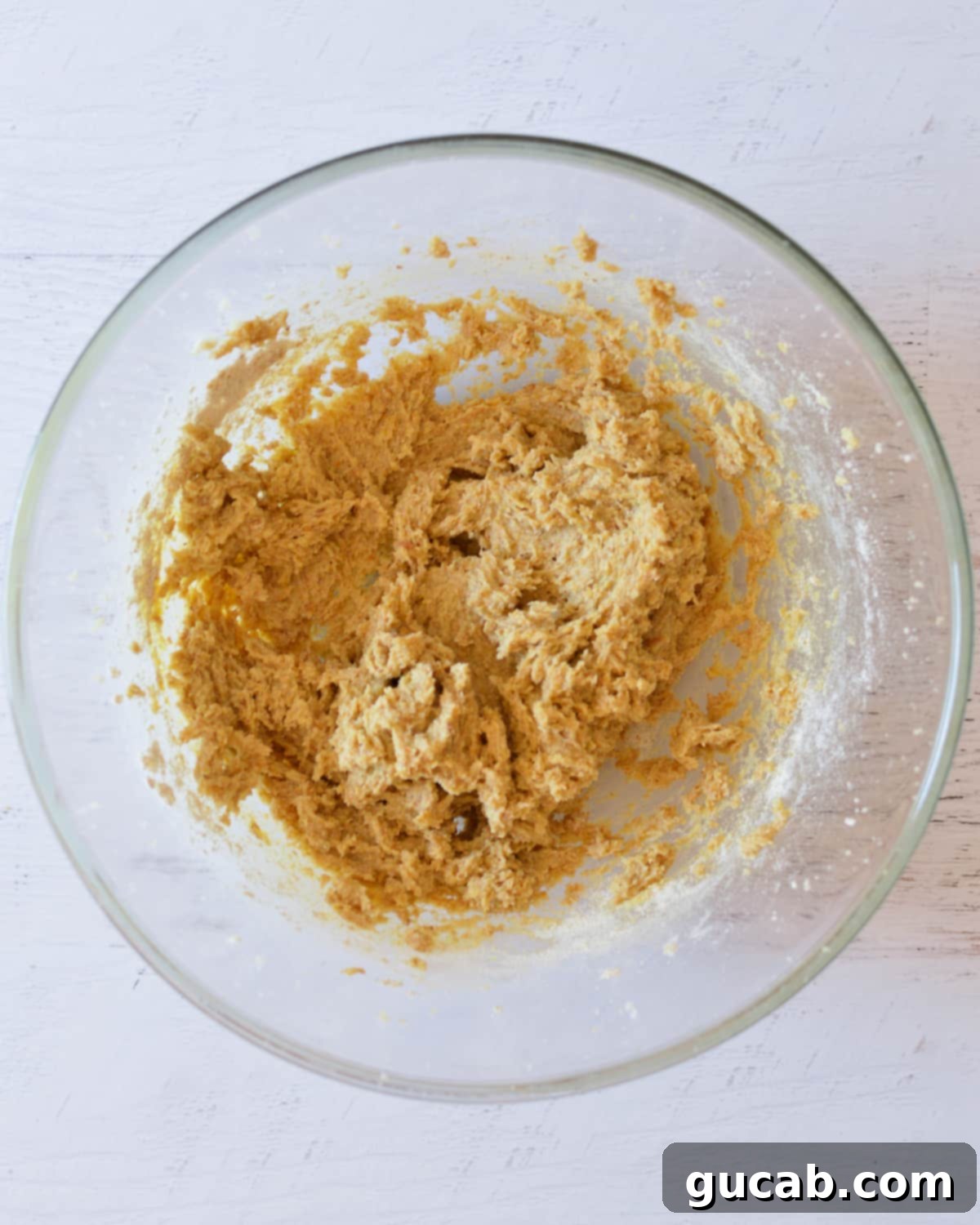 Butter, sugar, eggs, and flax meal beaten together to form a uniform base for the cookie dough.