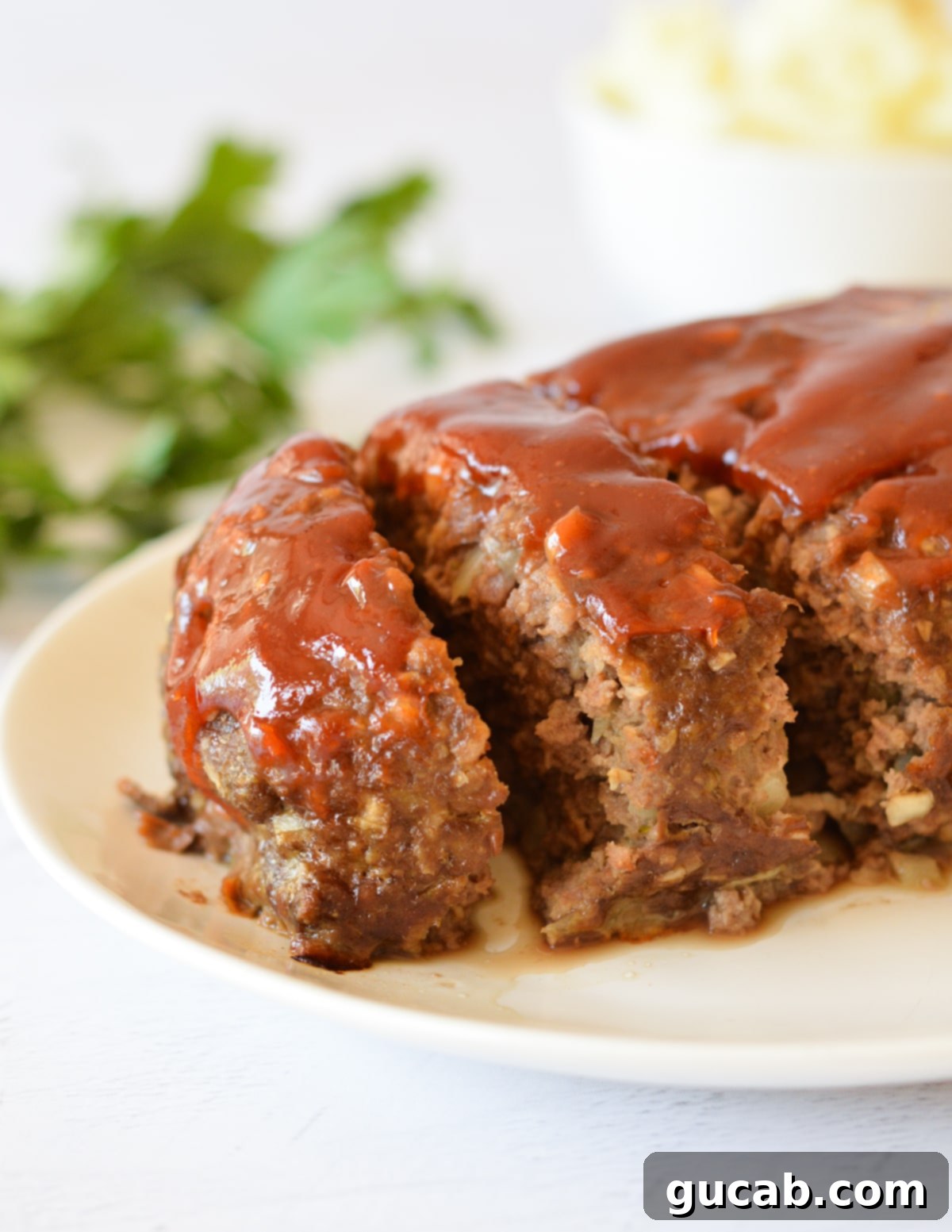 sliced meatloaf with glaze on top.