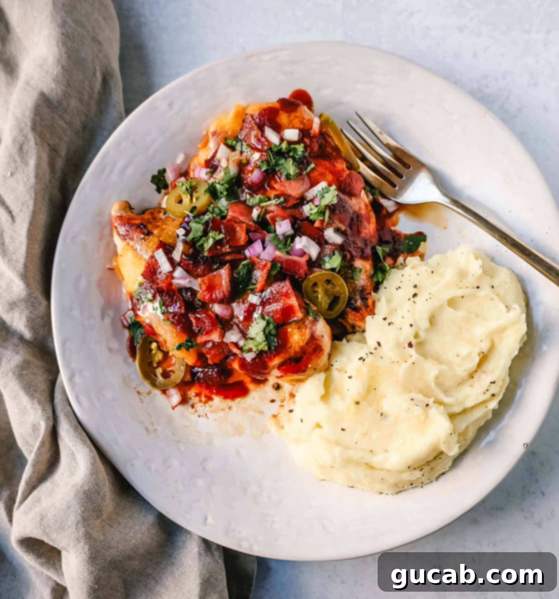 barbecue chicken with bacon and mashed potatoes. 