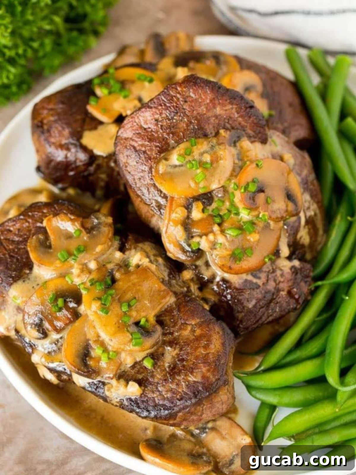steak with mushrooms and green beans. 