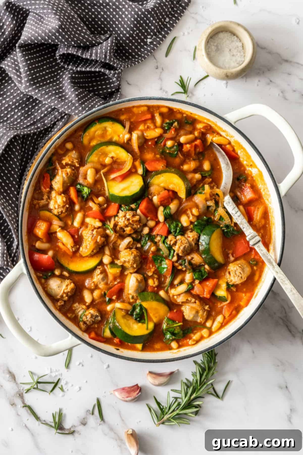 a pot of sausage casserole with zucchini