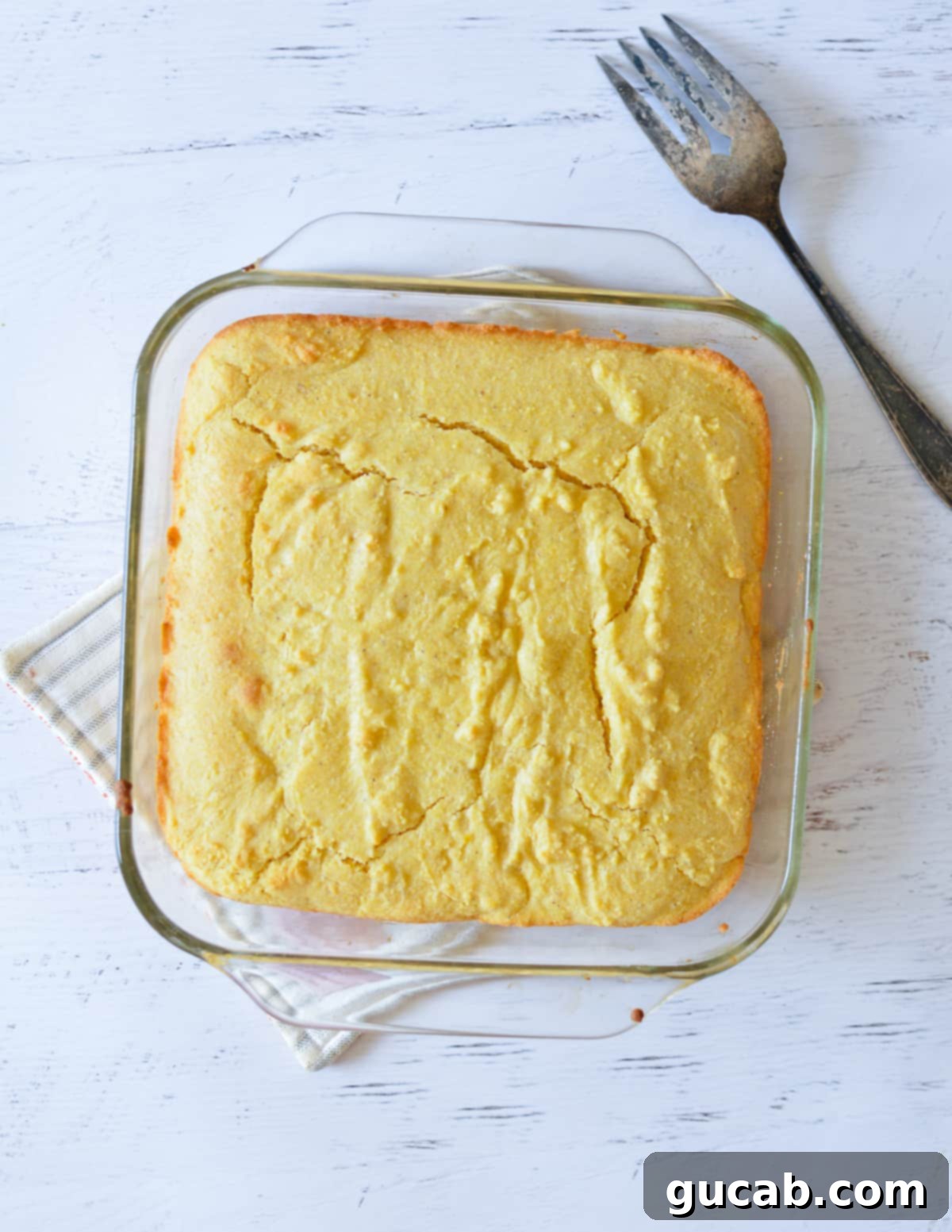 baked cornbread in glass dish. 