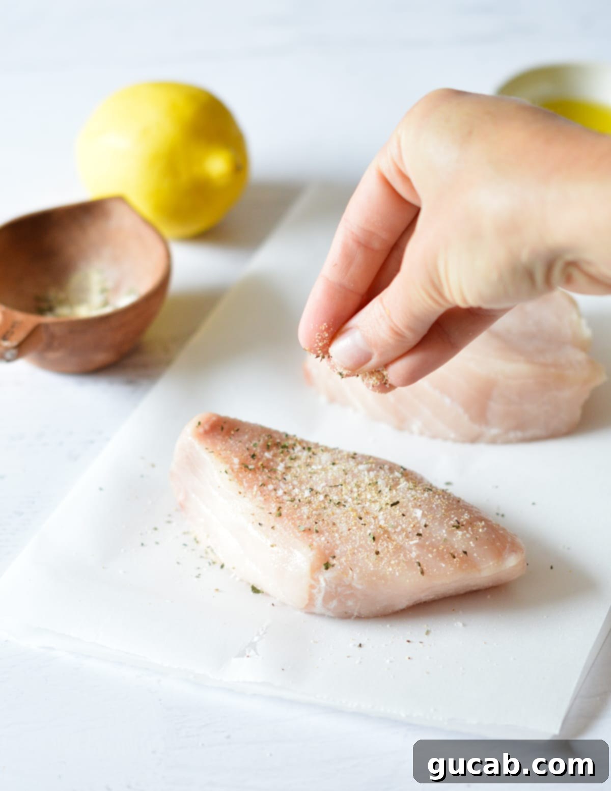 raw swordfish with seasoning on it. 