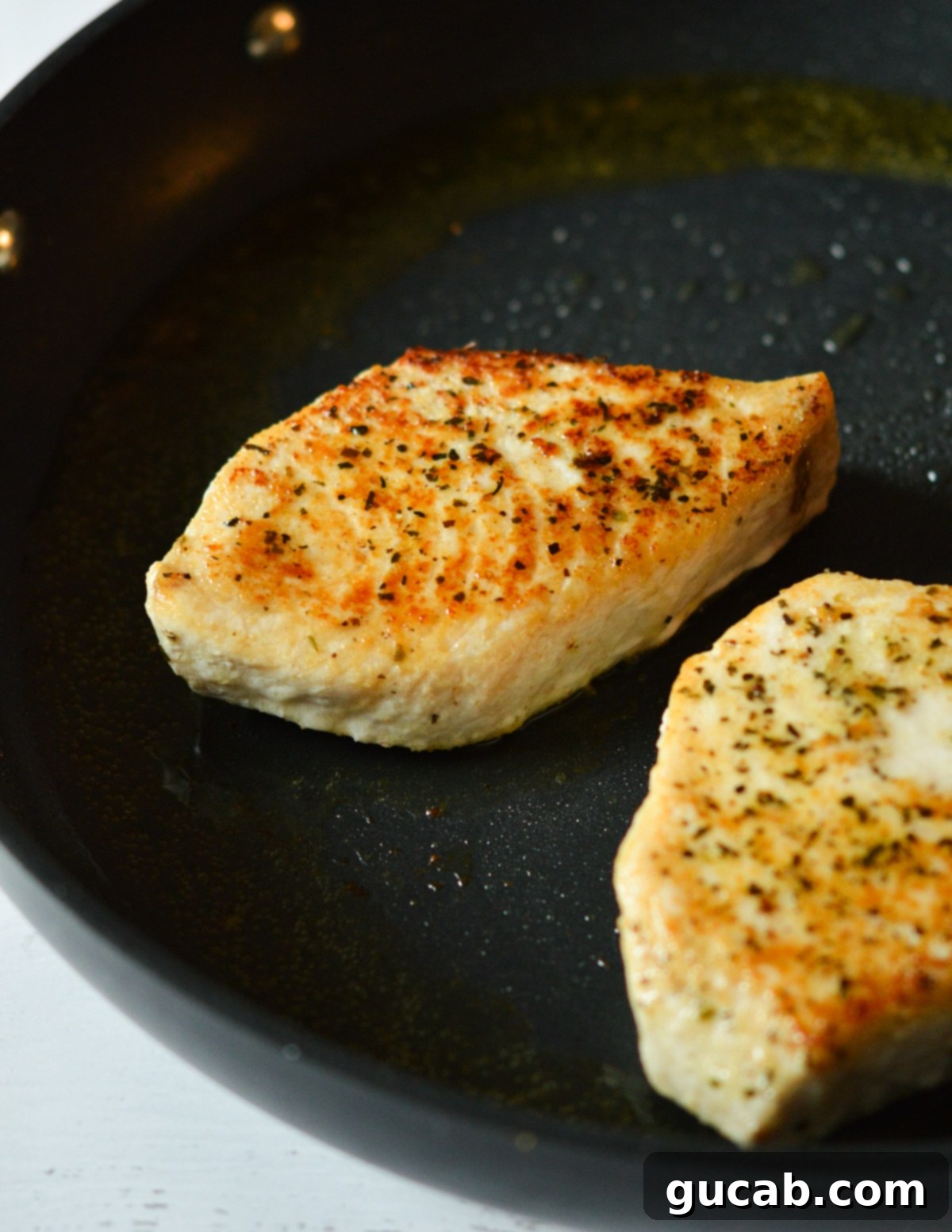 cooked swordfish in a skillet. 