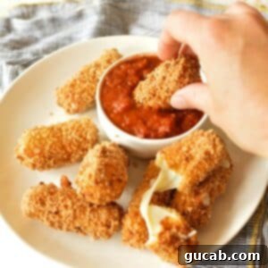 Irresistible Gluten-Free Mozzarella Sticks 14 a plate of gluten free mozzarella sticks with marinara