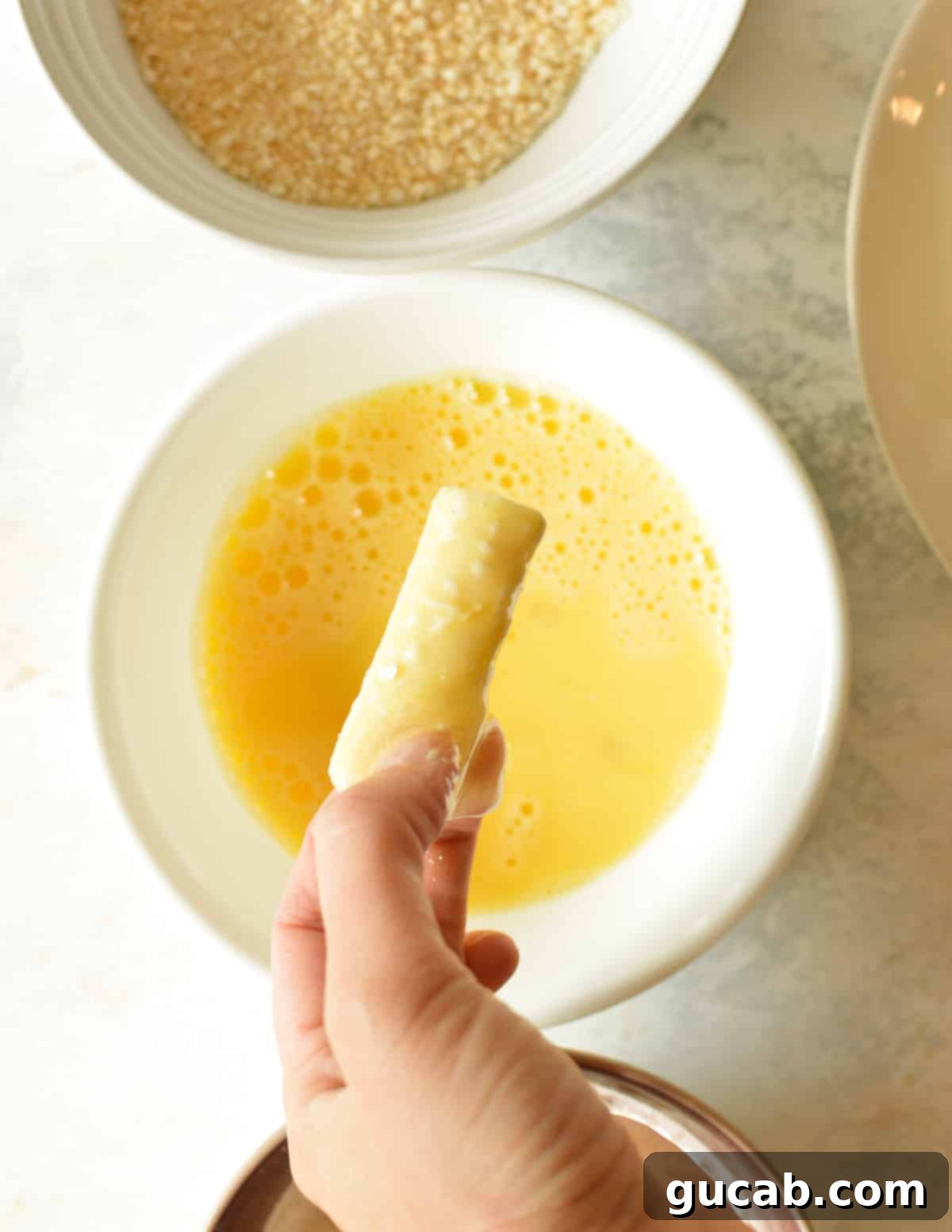 Irresistible Gluten-Free Mozzarella Sticks 6 a cheese stick covered in egg