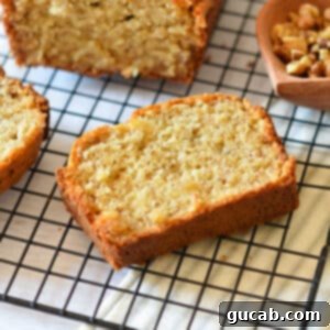 The Key to Amazing Banana Bread Frozen Bananas 15 A slice of perfect, moist banana bread, showing its inviting texture and golden-brown crust.