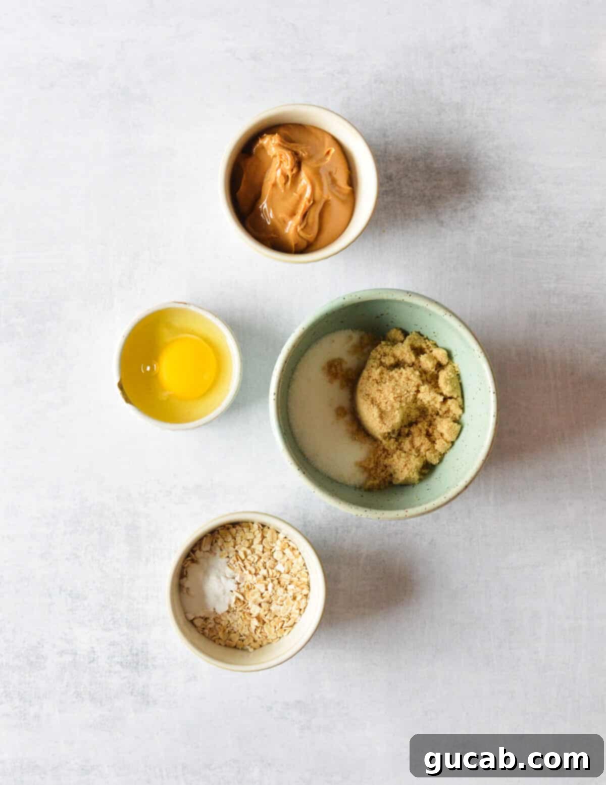 peanut butter, egg, sugar, brown sugar, quick oats, baking soda. 