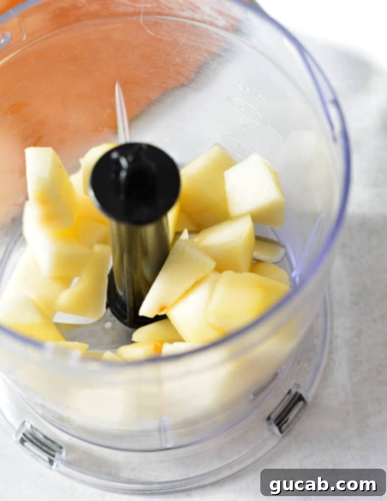 chopped pear in mini food processor.