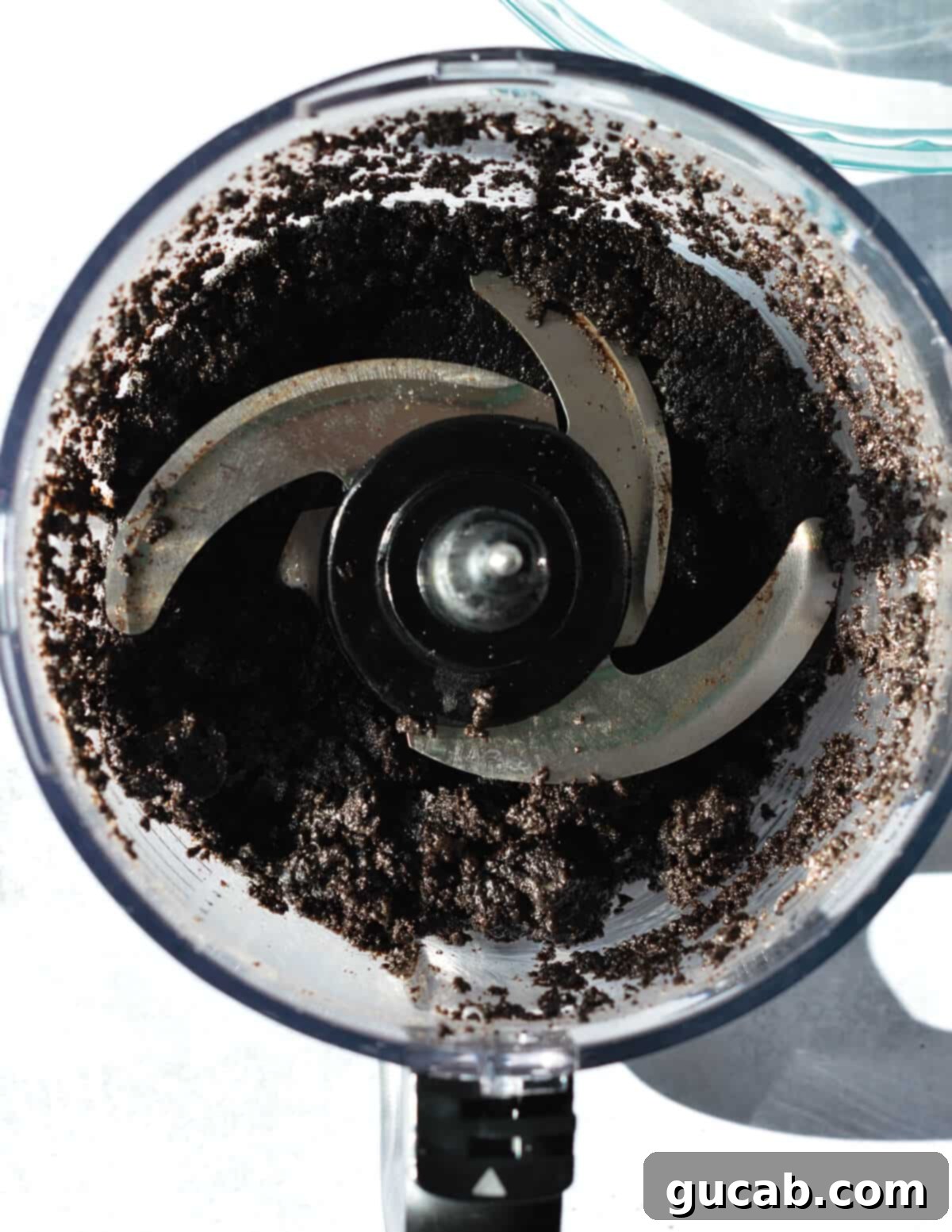 The Ultimate Gluten-Free Oreo Pie Crust 7 gluten free chocolate cookie crumbs in a food processor.