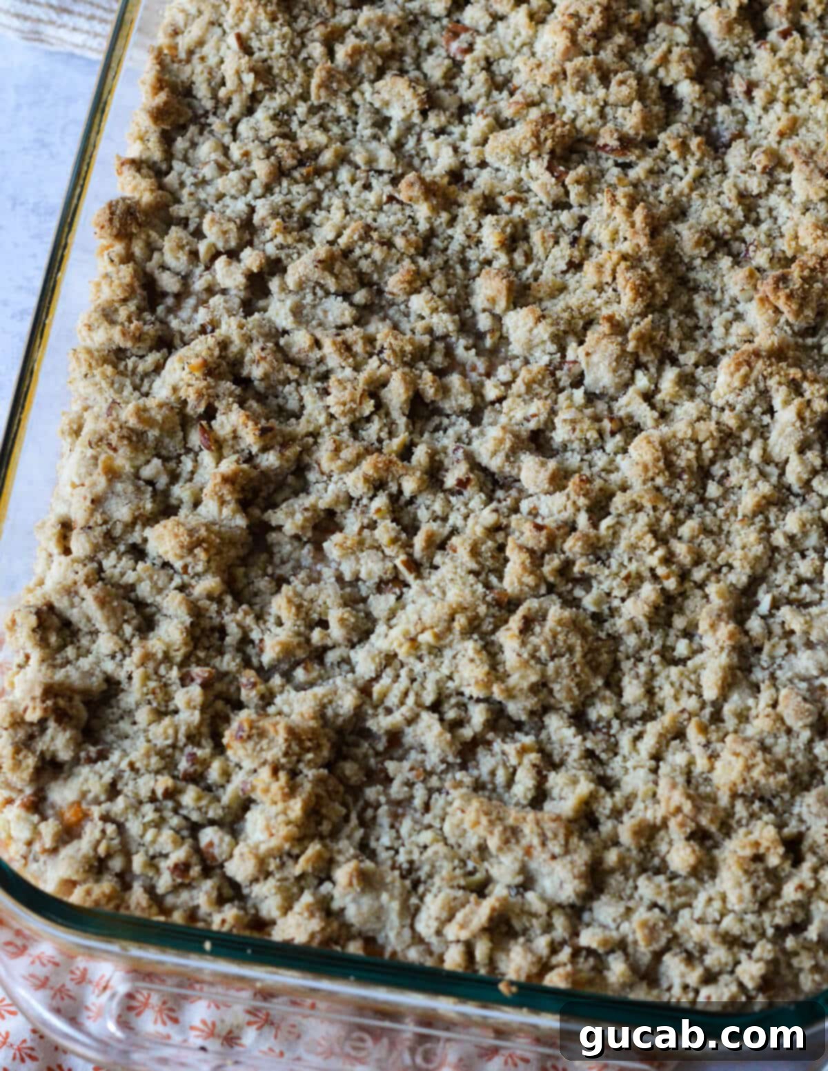 Heavenly Sweet Potato Casserole 14 A freshly baked sweet potato casserole with a golden brown crumb topping, just before adding marshmallows.