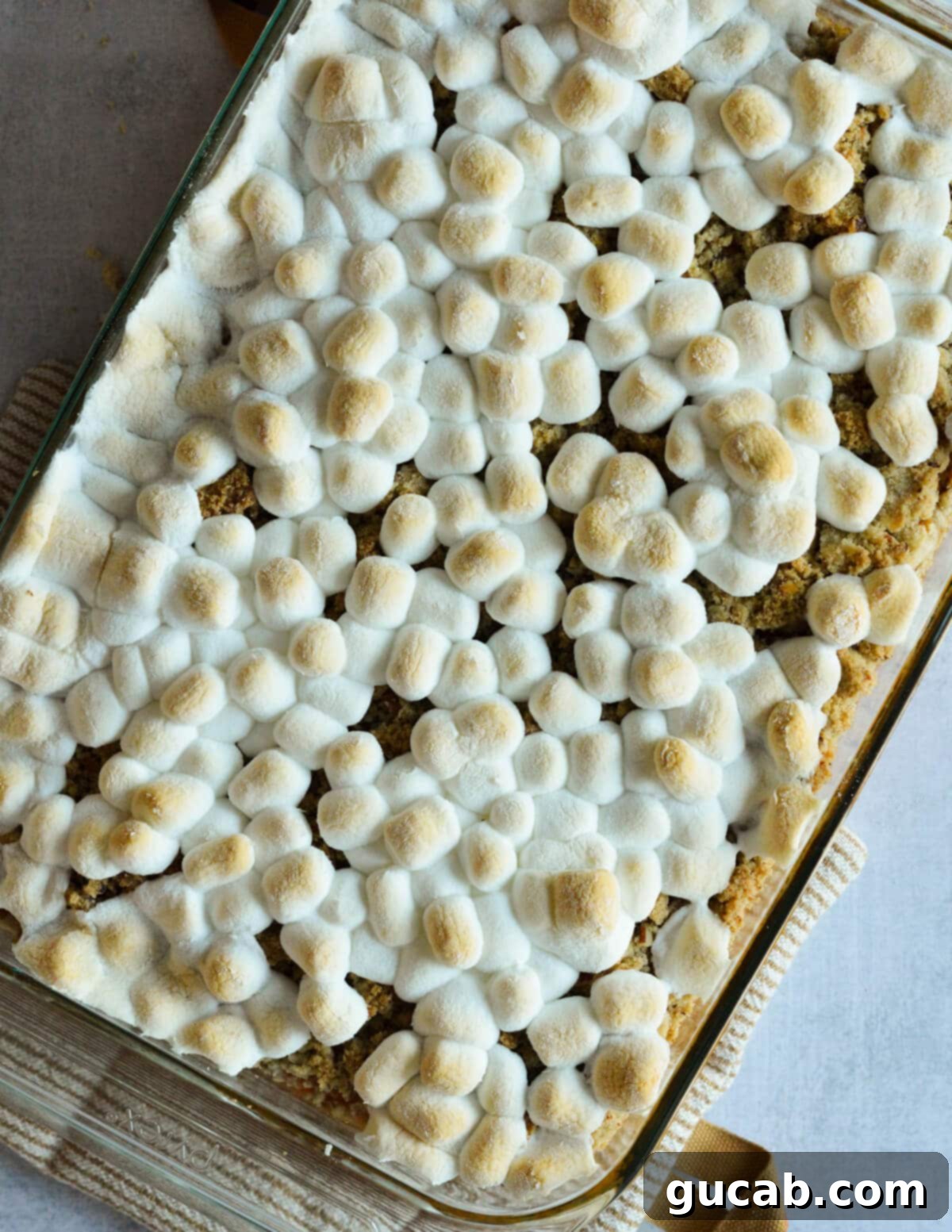 Heavenly Sweet Potato Casserole 15 The final sweet potato casserole, topped with beautifully golden and toasted marshmallows, glistening and ready to serve.