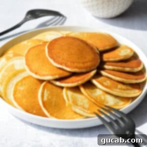 a plate of silver dollar pancakes.