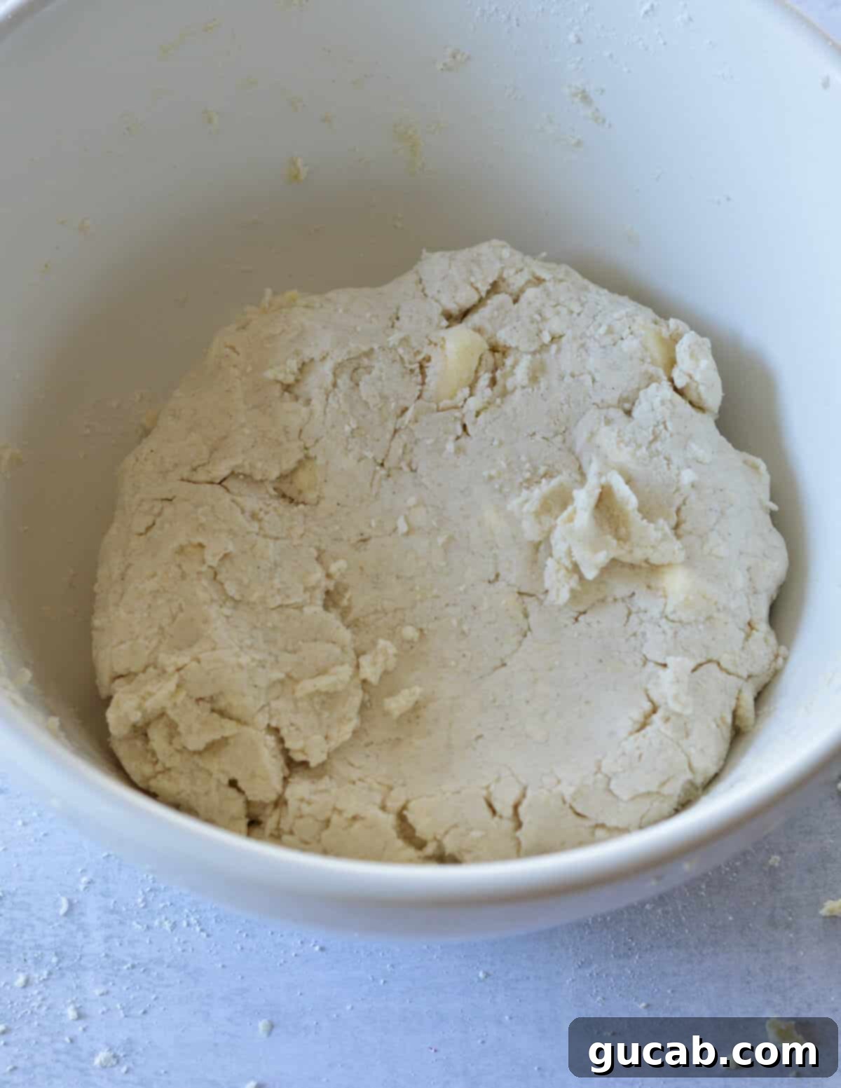 a bowl of gluten free biscuit dough.