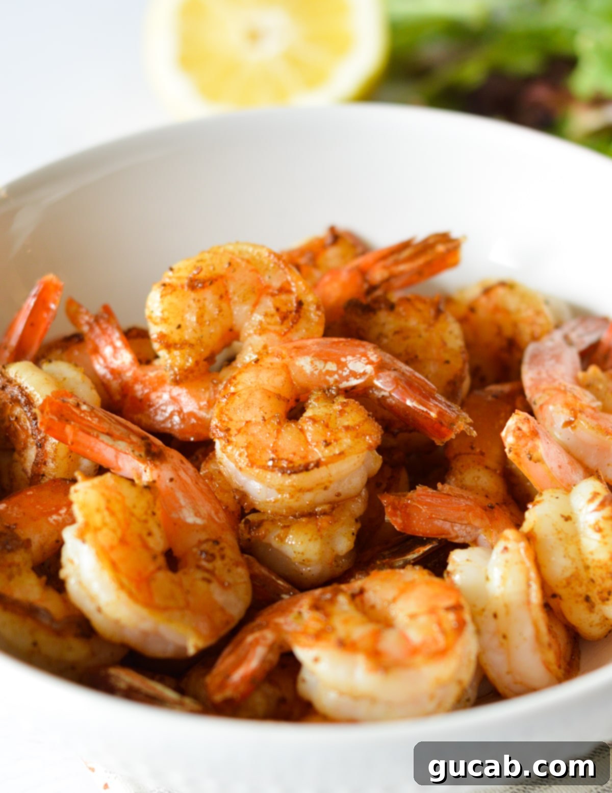 a bowl of seared shrimp. 