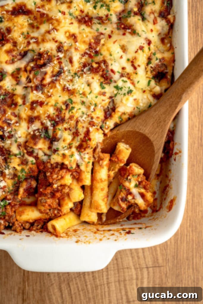 a casserole dish with baked ziti in it. 