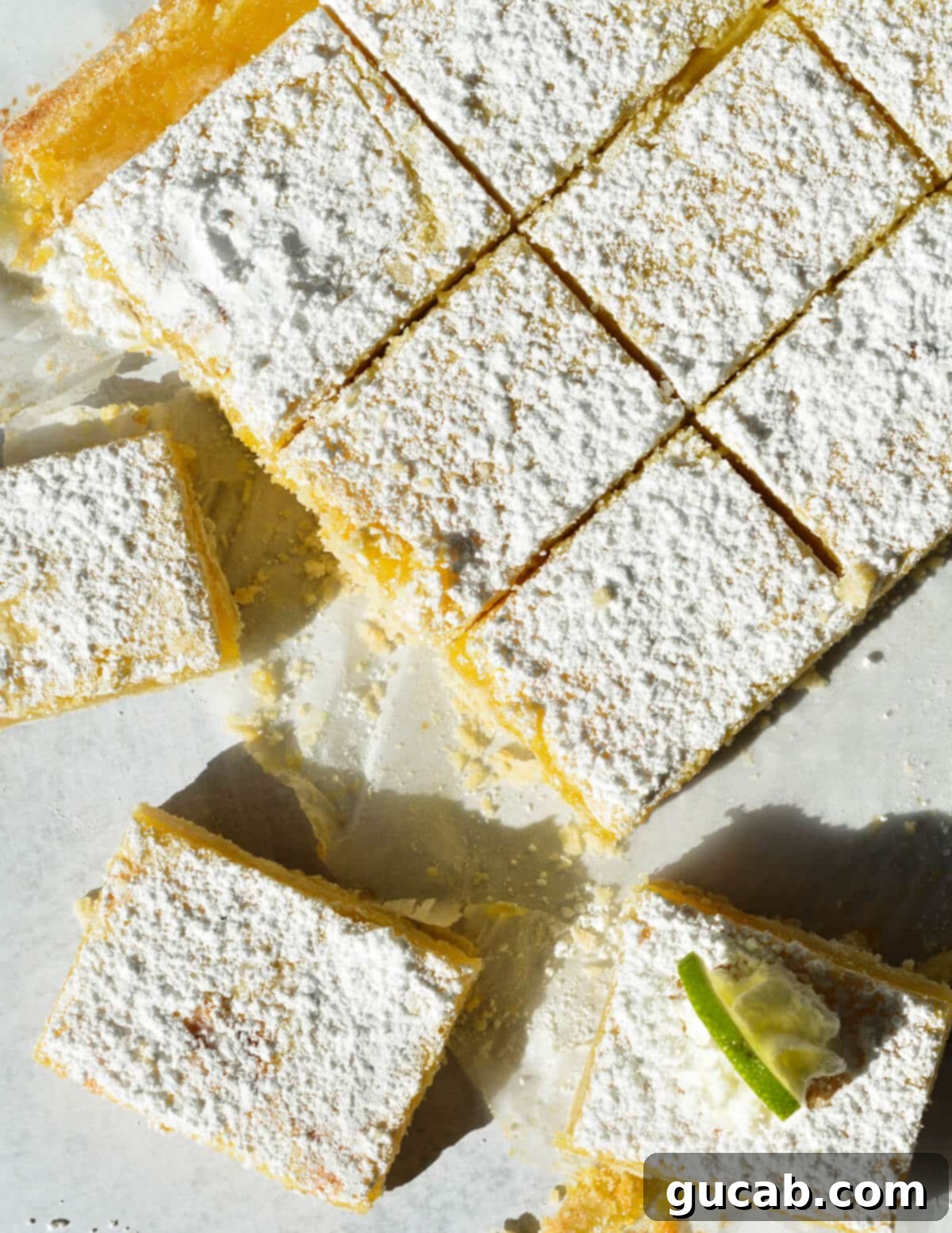 Close-up of freshly sliced gluten-free key lime bars, highlighting the creamy texture of the filling.