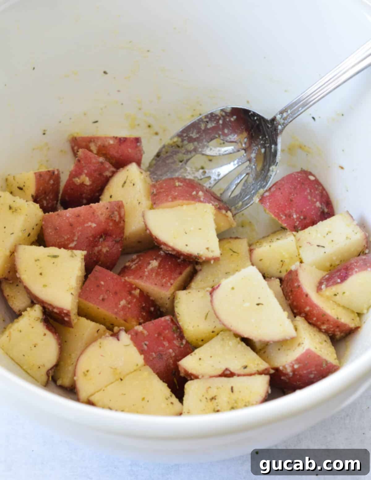 cut red potatoes tossed in olive oil and seasoning. 