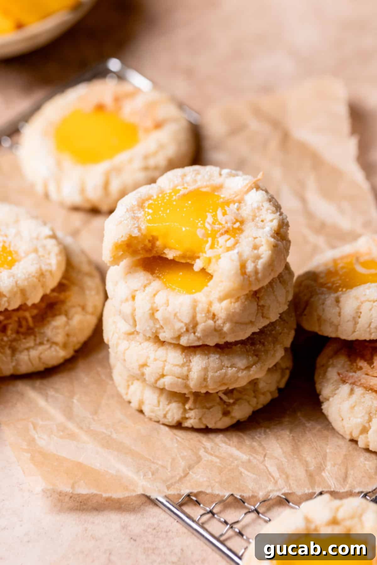 Sun-Kissed Mango Creations 11 A stack of soft coconut mango cookies with a dollop of mango curd.