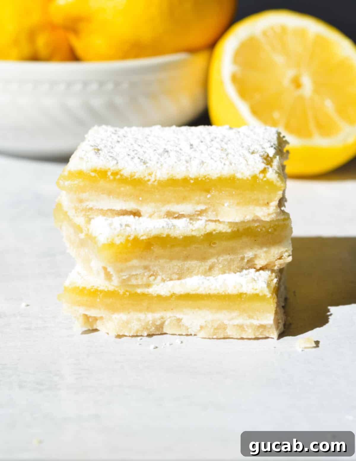 a stack of gluten free lemon bars. 