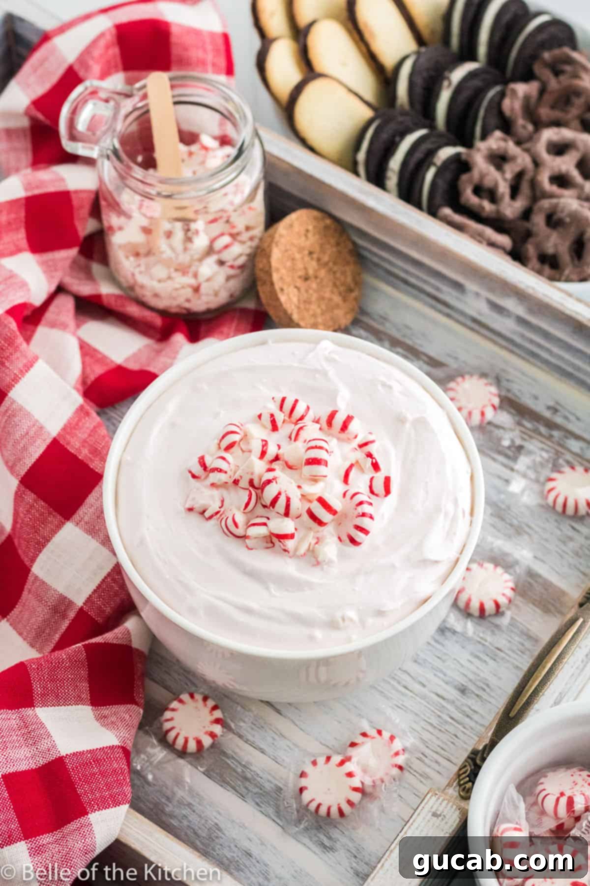 19 Peppermint Desserts to Sweeten Your Holidays 14 a bowl of peppermint cheesecake dip with crushed peppermints on top.