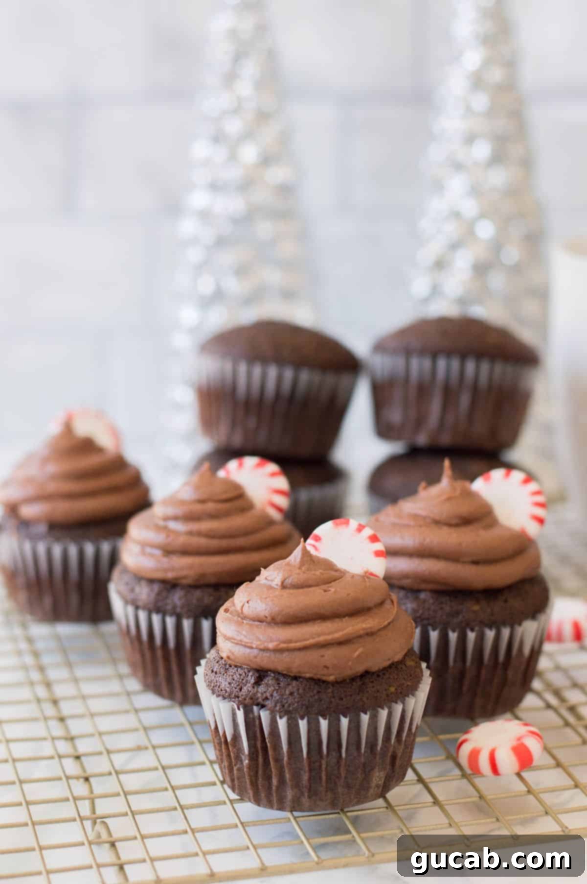 19 Peppermint Desserts to Sweeten Your Holidays 22 peppermint mocha cupcakes on a wire rack.