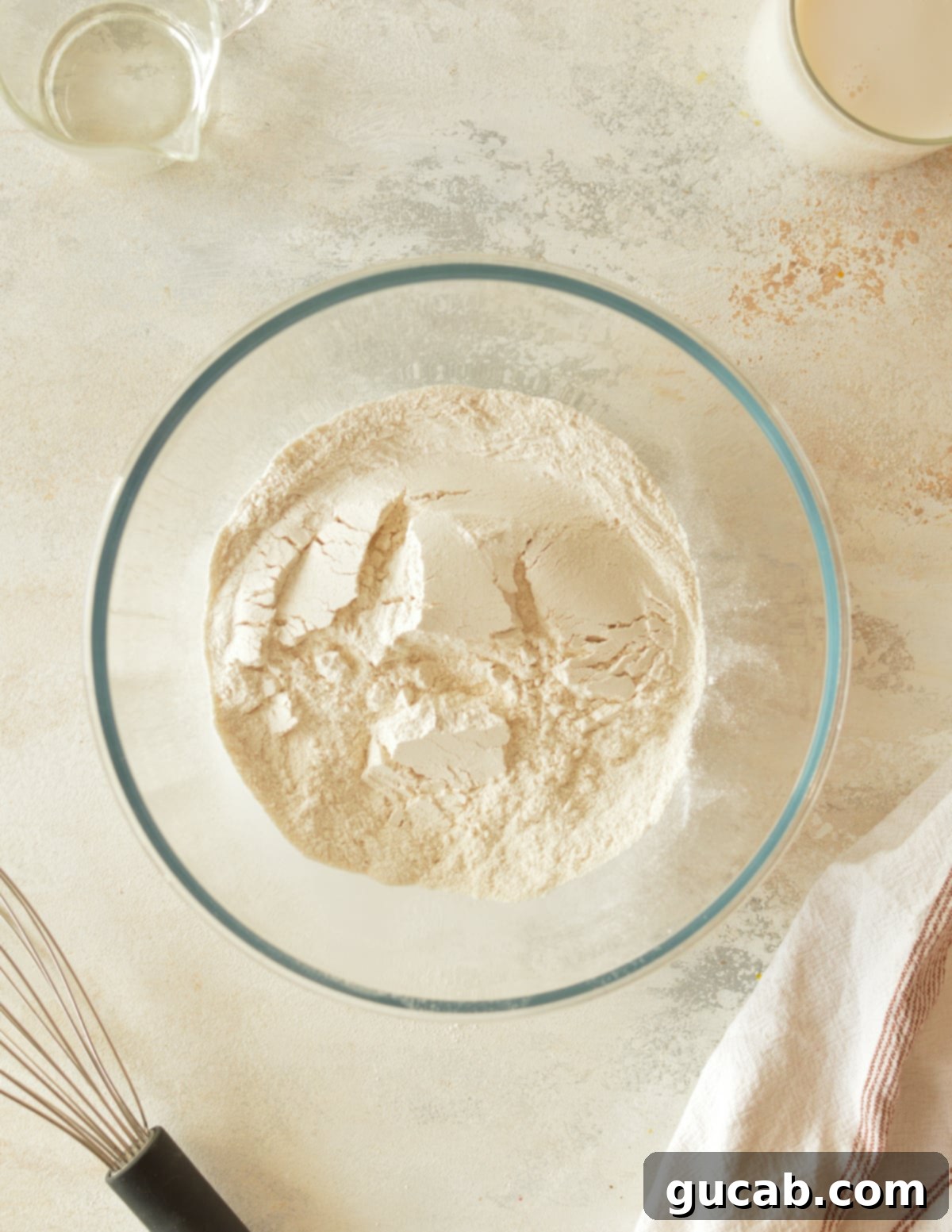 A bowl containing cassava flour, baking powder, and kosher salt, mixed together.