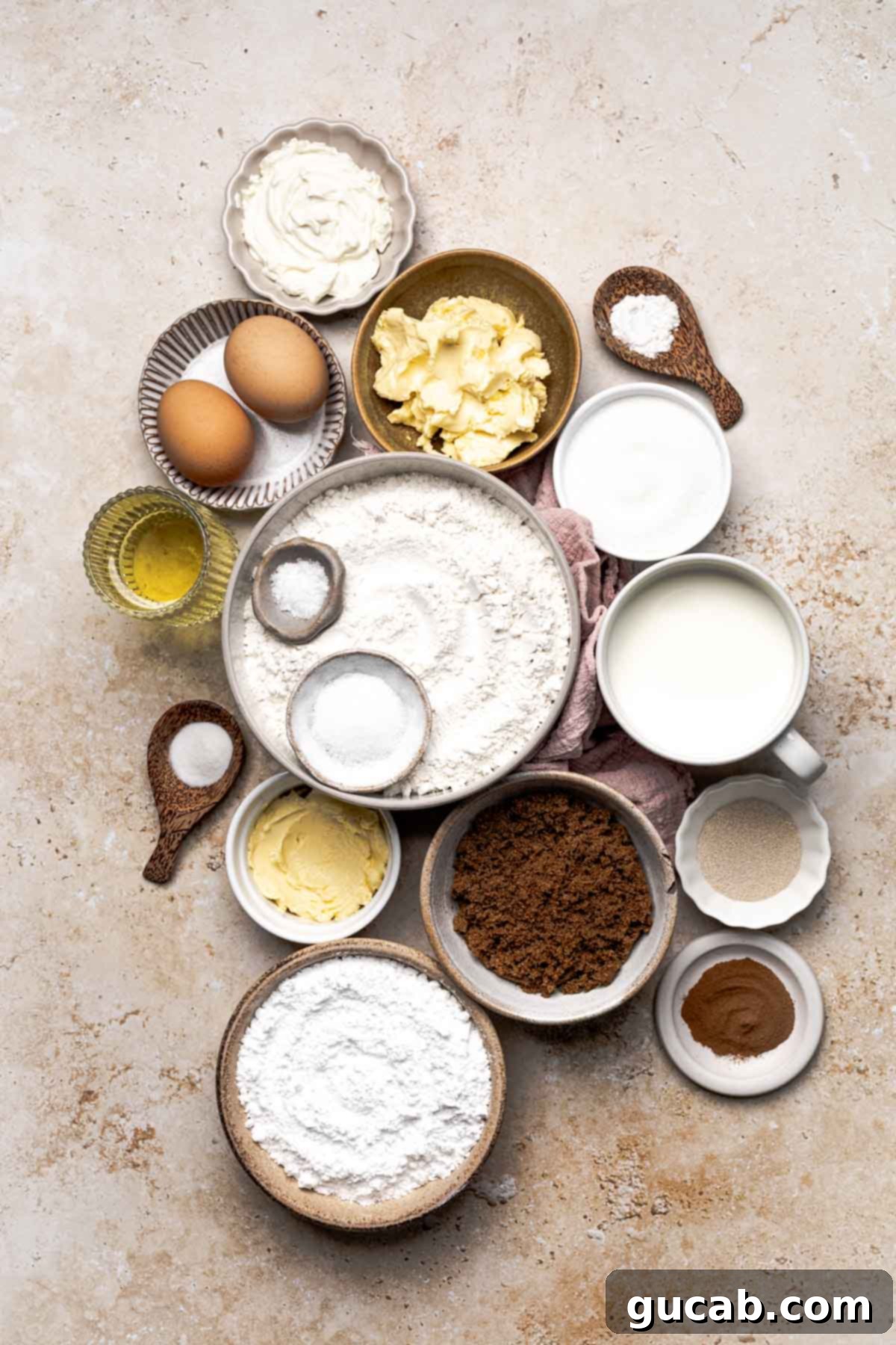 Irresistible Gluten-Free Cinnamon Rolls 4 A collection of essential ingredients for gluten-free cinnamon rolls: eggs, butter, cream cheese, vegetable oil, salt, ground cinnamon, brown sugar, powdered sugar, active dry yeast, and a bag of gluten-free all-purpose flour blend.